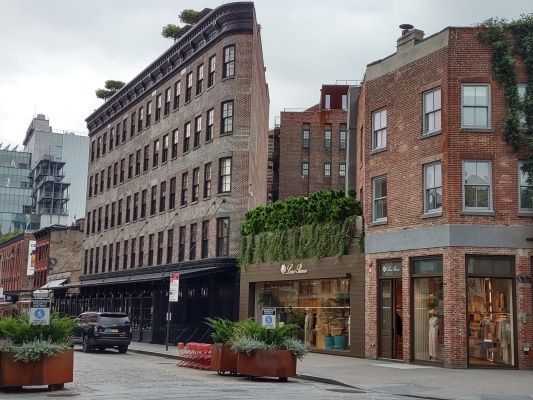 rooftop additions, facade alterations, and sidewalk replacement